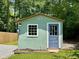 Charming backyard shed with unique details, offering a delightful space for hobbies and storage at 485 Angham Rd, Hiram, GA 30141