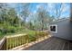 View of a well-maintained, grassy backyard from the wooden deck at 5153 Westbrook Pl, Union City, GA 30291