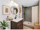 Updated bathroom features modern decor, a gray tile shower, and a wood vanity at 5153 Westbrook Pl, Union City, GA 30291