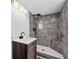 Updated bathroom features stylish gray tile shower with black fixtures and a white sink at 5153 Westbrook Pl, Union City, GA 30291