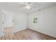 Bright bedroom with wood-look floors, a ceiling fan, and neutral paint at 5153 Westbrook Pl, Union City, GA 30291
