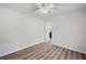 Bright bedroom with wood-look floors, neutral paint, and a ceiling fan at 5153 Westbrook Pl, Union City, GA 30291