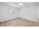 Bright bedroom with wood-look floors, a ceiling fan, and a window at 5153 Westbrook Pl, Union City, GA 30291
