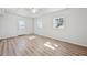 Light-filled bedroom with wood-look flooring, natural light, and a bright door at 5153 Westbrook Pl, Union City, GA 30291