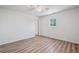 Bright bedroom with wood-look floors, a window view, and a ceiling fan at 5153 Westbrook Pl, Union City, GA 30291