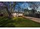 Charming home featuring a large yard with mature trees and a ramp entrance at 5153 Westbrook Pl, Union City, GA 30291