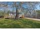 Home exterior showcasing a spacious yard with mature trees at 5153 Westbrook Pl, Union City, GA 30291
