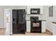 Close up of the kitchen with black appliances and white subway tile backsplash at 5153 Westbrook Pl, Union City, GA 30291