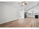A spacious living room showcases sleek wood floors and a modern kitchen at 5153 Westbrook Pl, Union City, GA 30291