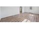 Open living space with wood-look flooring, white trim, and ample natural light at 5153 Westbrook Pl, Union City, GA 30291