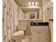 Neutral bathroom with a vanity, floral shower curtain, and a standard toilet at 6700 Roswell Rd # 22B, Atlanta, GA 30328