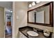 Well-maintained bathroom featuring granite countertops and a large mirror at 6700 Roswell Rd # 22B, Atlanta, GA 30328