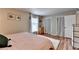 Well-lit bedroom showcasing neutral walls, wood floors, and a comfortable bed at 6700 Roswell Rd # 22B, Atlanta, GA 30328