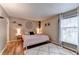 Inviting bedroom with neutral walls, stylish decor, and large window allowing natural light at 6700 Roswell Rd # 22B, Atlanta, GA 30328