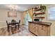 Charming dining area with modern lighting, table setting, floating shelves and sliding door at 6700 Roswell Rd # 22B, Atlanta, GA 30328