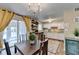 Dining room with table and chairs, sliding glass door, and bright open concept at 6700 Roswell Rd # 22B, Atlanta, GA 30328