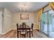 Bright dining room featuring modern lighting and sliding glass doors to patio at 6700 Roswell Rd # 22B, Atlanta, GA 30328