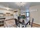 Open-concept layout, connecting the kitchen, dining area, and living room at 6700 Roswell Rd # 22B, Atlanta, GA 30328