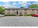 Charming brick condo building with ample parking and well-maintained landscaping at 6700 Roswell Rd # 22B, Atlanta, GA 30328