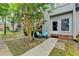 Building exterior view featuring a patio with outdoor seating and lush landscaping at 6700 Roswell Rd # 22B, Atlanta, GA 30328