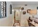 Entryway features neutral walls, warm lighting, hardwood floors and decorative wall art at 6700 Roswell Rd # 22B, Atlanta, GA 30328