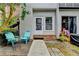 Back patio area with outdoor seating and a view of the unit's exterior and landscaping at 6700 Roswell Rd # 22B, Atlanta, GA 30328