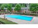 Community swimming pool with lounge chairs and well-maintained landscaping surrounding it at 6700 Roswell Rd # 22B, Atlanta, GA 30328