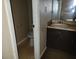 Bathroom featuring a toilet, sink with dark vanity, and storage shelf at 1094 Reynolds Ct, Morrow, GA 30260