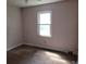 Comfortable bedroom with light pink walls and a window that provides natural light at 1094 Reynolds Ct, Morrow, GA 30260