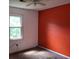 Spacious bedroom features a ceiling fan and a large window that provides plenty of natural light at 1094 Reynolds Ct, Morrow, GA 30260
