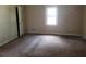 Cozy bedroom with a window providing natural light and ample space at 1094 Reynolds Ct, Morrow, GA 30260
