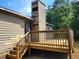 This home has a rear wooden deck with railings and stairs to the back yard at 1094 Reynolds Ct, Morrow, GA 30260