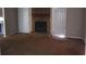 Spacious living room featuring a stone fireplace, doors, and neutral tones at 1094 Reynolds Ct, Morrow, GA 30260