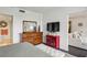 Bright bedroom featuring wood dresser, white ottoman, and view to living room at 1130 Piedmont Ne Ave # 709, Atlanta, GA 30309