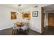 Dining area showcasing a round table, modern lighting, and an open flow to the kitchen at 1130 Piedmont Ne Ave # 709, Atlanta, GA 30309