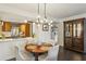 Elegant dining area featuring modern lighting, hardwood flooring, and open flow to the kitchen at 1130 Piedmont Ne Ave # 709, Atlanta, GA 30309
