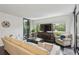 Bright living area featuring hardwood floors, a comfortable sofa, and floor to ceiling windows at 1130 Piedmont Ne Ave # 709, Atlanta, GA 30309