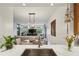 Open-concept living area showcasing a large sectional sofa, contemporary lighting, and outside views at 1130 Piedmont Ne Ave # 709, Atlanta, GA 30309