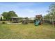 Large backyard featuring a playset, gazebo and plenty of space for outdoor activities at 1221 Fountain Head Ct, Lawrenceville, GA 30043