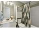 Bathroom featuring a vanity with a single sink, vanity lights, toilet, and a shower/tub combination at 1221 Fountain Head Ct, Lawrenceville, GA 30043