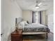 Comfortable bedroom with hardwood floors, ceiling fan, and a neutral color scheme for a relaxing atmosphere at 1221 Fountain Head Ct, Lawrenceville, GA 30043