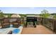 Back deck with outdoor seating and a grill, perfect for entertaining at 1221 Fountain Head Ct, Lawrenceville, GA 30043