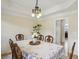 Traditional dining room with elegant chandelier and hardwood floors at 1221 Fountain Head Ct, Lawrenceville, GA 30043