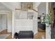 Bright foyer with hardwood floors, staircase, and entry to living room at 1221 Fountain Head Ct, Lawrenceville, GA 30043