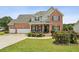 Charming two-story brick home with well-manicured lawn and two-car garage at 1221 Fountain Head Ct, Lawrenceville, GA 30043
