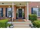 Inviting front porch with stylish decor and a welcoming entrance at 1221 Fountain Head Ct, Lawrenceville, GA 30043