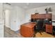 Home office with a large desk, bookshelves, and natural light at 1221 Fountain Head Ct, Lawrenceville, GA 30043