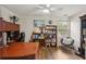 Home office with a desk, bookshelves, and a comfortable chair at 1221 Fountain Head Ct, Lawrenceville, GA 30043