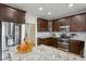 Stylish kitchen with granite countertops and stainless steel appliances at 1221 Fountain Head Ct, Lawrenceville, GA 30043