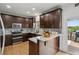 Well-appointed kitchen with stainless steel appliances and breakfast bar area at 1221 Fountain Head Ct, Lawrenceville, GA 30043